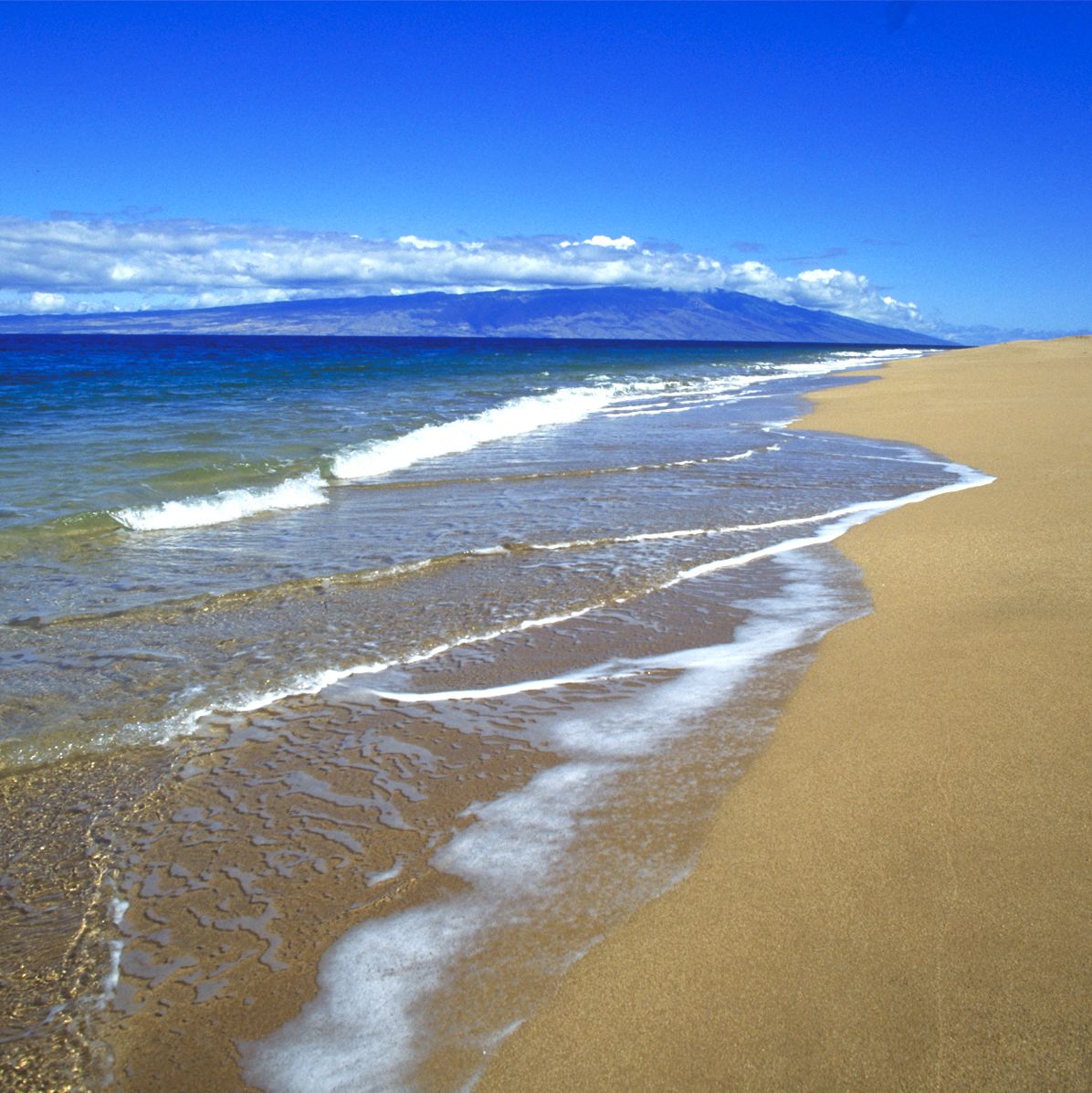 Polihua Beach, on the northwest coast of Lanai, with Molokai in background. Polihua Beach Lanai Molokai ocean horizontal landscape day Kirk Aeder. Please credit the photographer in any printed piece in which this image is used.