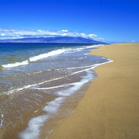 Polihua Beach, on the northwest coast of Lanai, with Molokai in background. Polihua Beach Lanai Molokai ocean horizontal landscape day Kirk Aeder. Please credit the photographer in any printed piece in which this image is used.