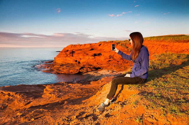 Handyfoto am roten Strand von Prince Edward Island