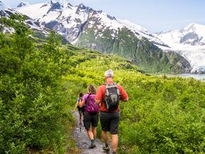 Visit Anchorage photo shoot - hikers descending Portage Pass