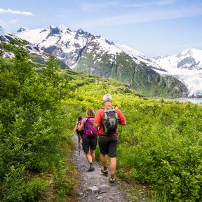 Visit Anchorage photo shoot - hikers descending Portage Pass