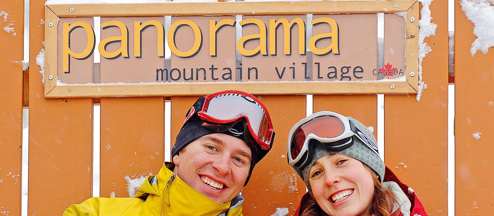 Close-up of a couple sitting in a giant chair in Panorama Mountain Village near Invermere.