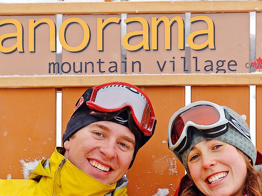 Close-up of a couple sitting in a giant chair in Panorama Mountain Village near Invermere.